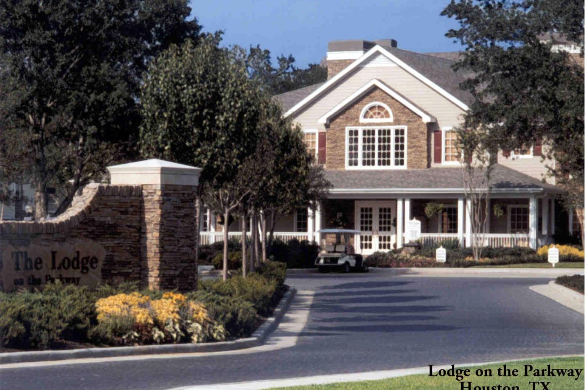 Lodge-style leasing center with stone accents and large windows, inspired by the Broadwater Galveston aesthetic, in Houston, Texas.