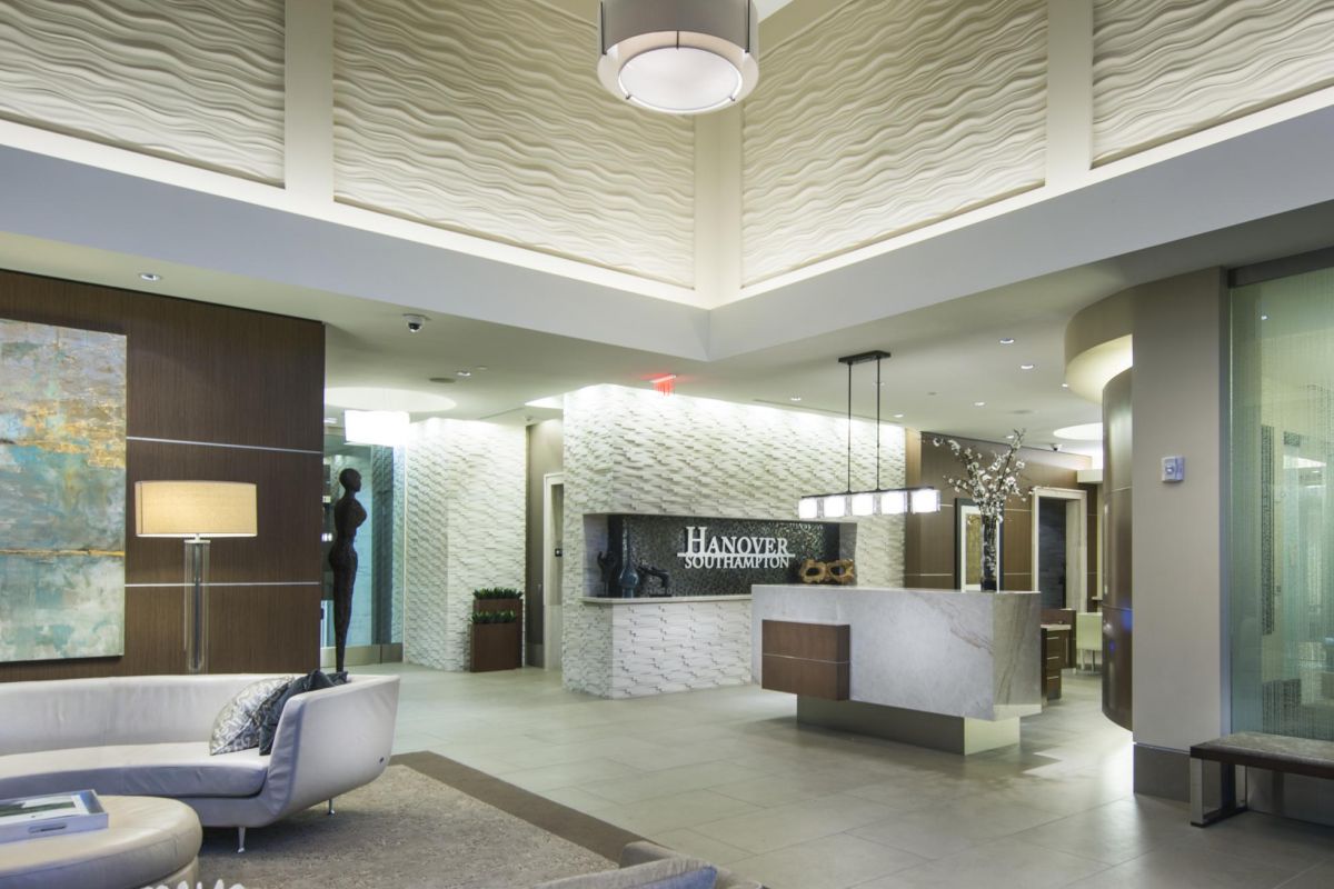 Hanover Company Modern hotel lobby with stylish seating, elegant lighting, and a reception desk at Hanover Inn.